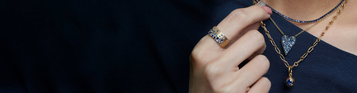 woman wearing sapphire necklaces by Single Stone and Sylva & Cie and Stardust