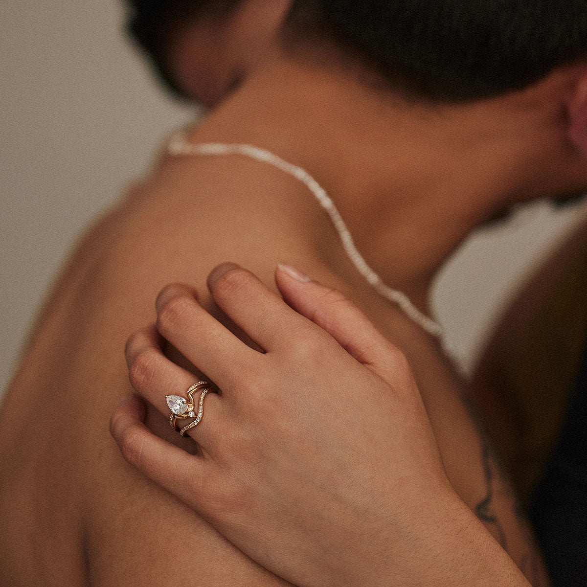 model wears gold and opal jewelry by WWAKE