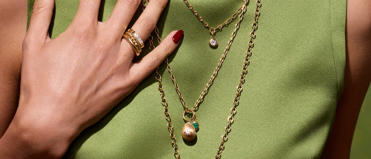 model wearing single stone jewelry and ring at greenwich st. jewelers