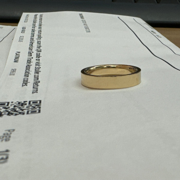 14K YELLOW GOLD "FLAT WALKER" 4 MM COMFORT FIT WEDDING BAND WITH HIGH POLISH FINISH BY G.ST CEREMONY.

SIZE 7