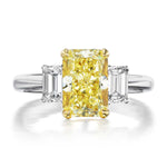 Three Stone Engagement Ring with a Fancy Yellow Diamond