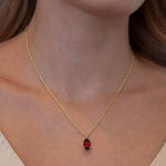 Oval Faceted Garnet Charm