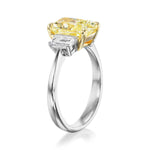 Three Stone Engagement Ring with a Fancy Yellow Diamond