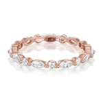 14K ROSE GOLD "LIBERTY" ETERNITY BAND FEATURING 0.49TCW MARQUISE DIAMONDS AND 0.32TCW ROUND BRILLIANT DIAMONDS (G/H COLOR, SI CLARITY) BY G.ST CEREMONY.