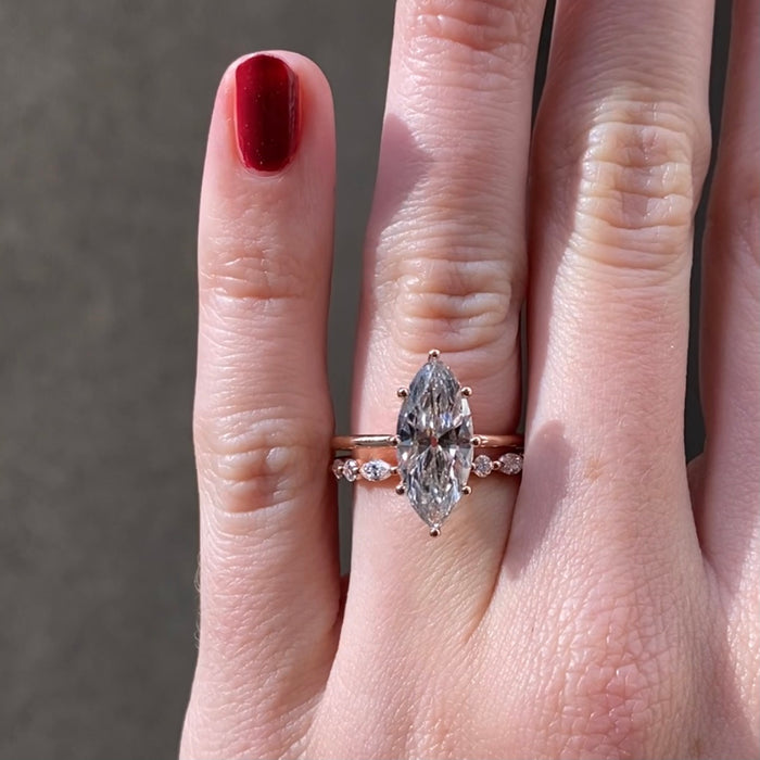 14K ROSE GOLD "LIBERTY" ETERNITY BAND FEATURING 0.49TCW MARQUISE DIAMONDS AND 0.32TCW ROUND BRILLIANT DIAMONDS (G/H COLOR, SI CLARITY) BY G.ST CEREMONY.