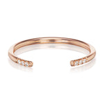 14K ROSE GOLD CLINTON (CUFF) WEDDING BAND BY G.ST CEREMONY, FEATURING A TRIO OF NATURAL ROUND BRILLIANT DIAMONDS ON EITHER SIDE OF A SPLIT SHANK.