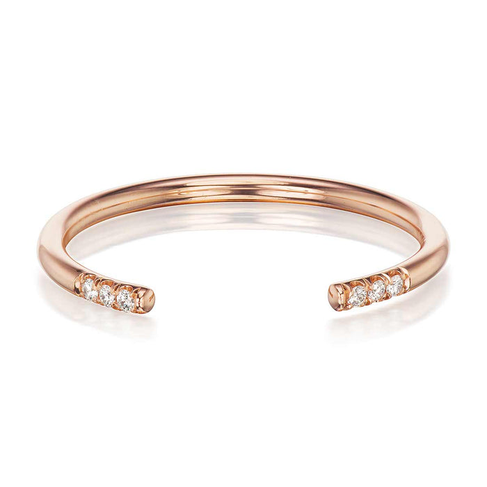 14K ROSE GOLD CLINTON (CUFF) WEDDING BAND BY G.ST CEREMONY, FEATURING A TRIO OF NATURAL ROUND BRILLIANT DIAMONDS ON EITHER SIDE OF A SPLIT SHANK.