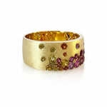 14K YELLOW GOLD CIGAR BAND WITH SATIN FINISH FEATURING 1.36TCW RAINBOW SAPPHIRES & TSAVORITES FLUSH SET, FROM STARDUST BY G.ST.

SIZE 6.75